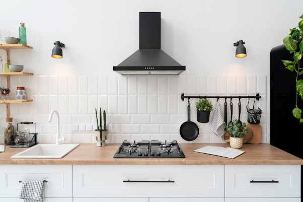 Crafting Culinary Spaces: The Art of Custom Craftsmanship in Tailoring Kitchen Chimney Designs